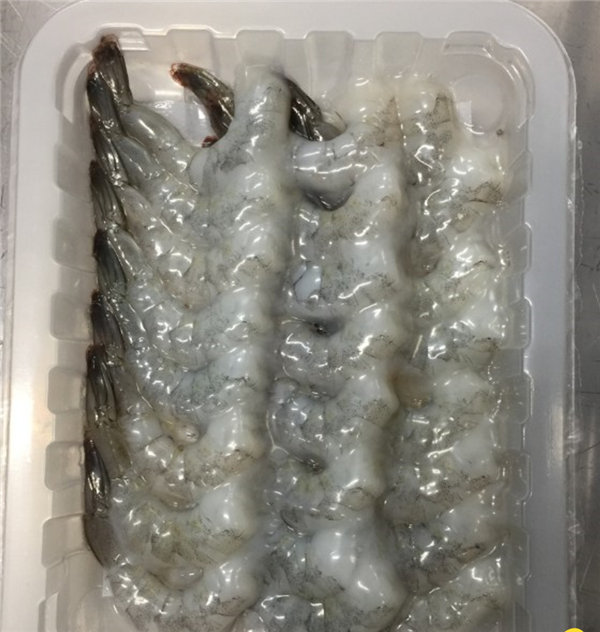 Raw shrimp in vacuum skin pack